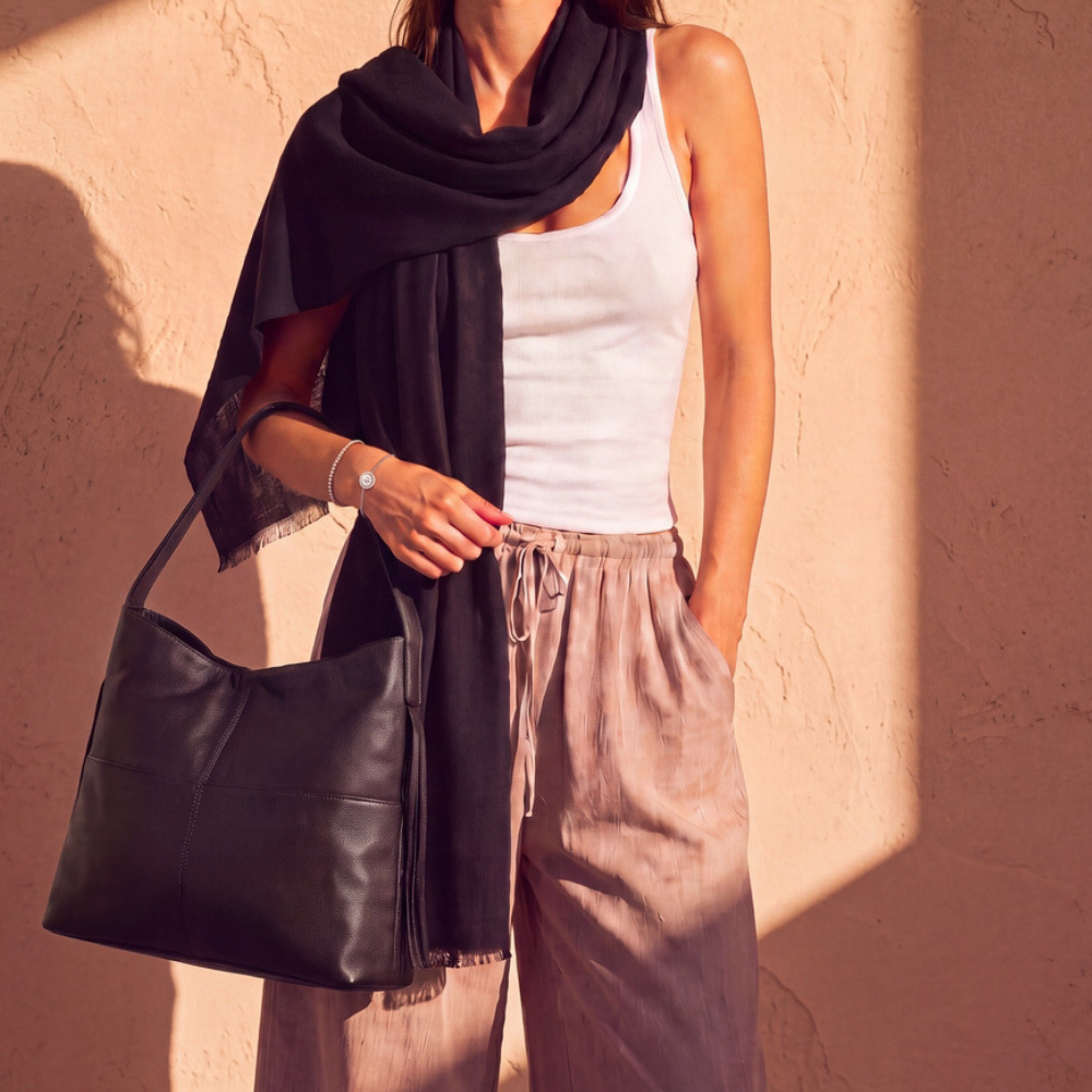 Model wearing an embossed leather backpack
