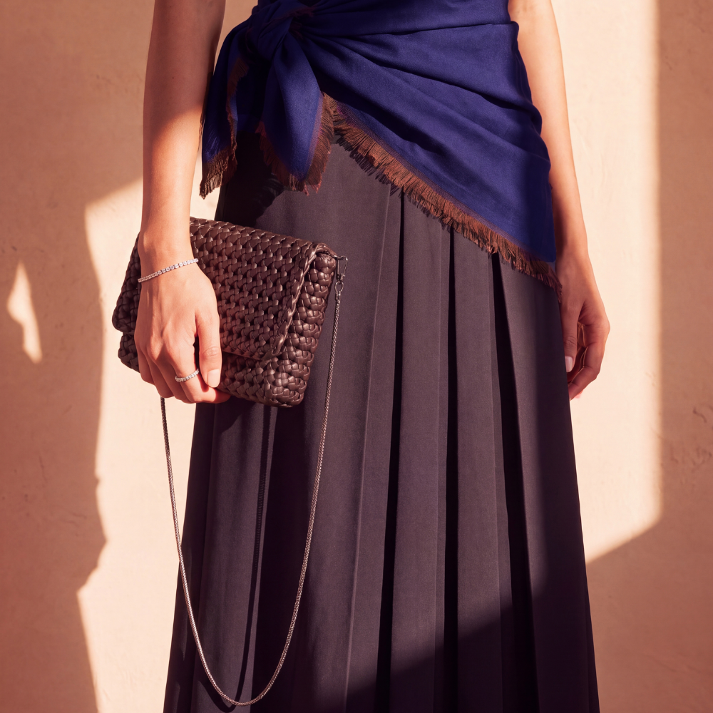 Model wearing an embossed leather backpack