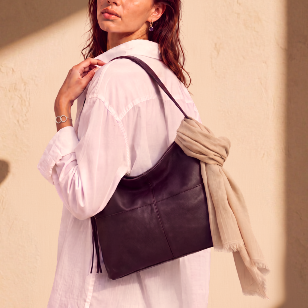 Model wearing an embossed leather backpack